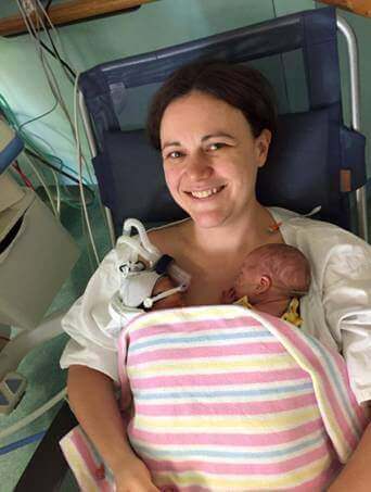 Deb Humphreys pictured in a precious moment with both her daughters. Photo: Supplied