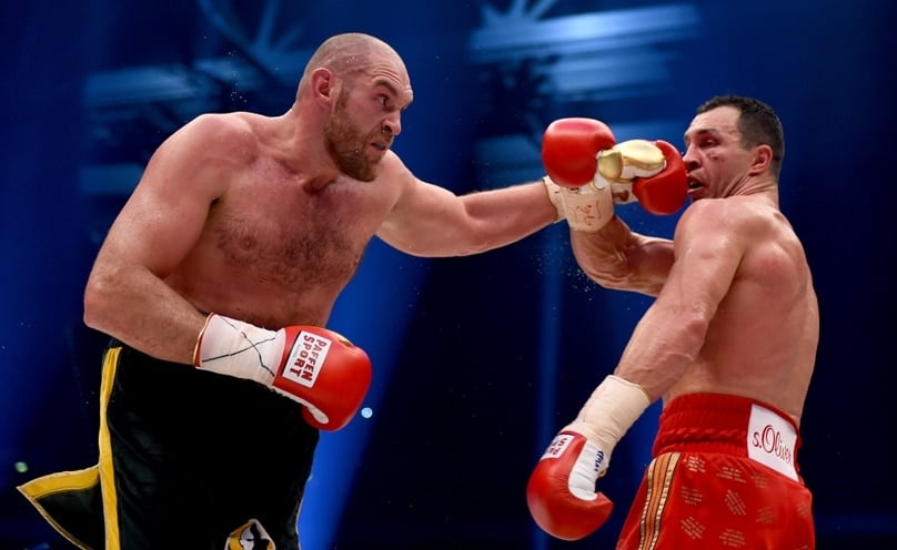 Tyson Fury, at left, in action with Wladimir Klitschko during their IBF/IBO/WBA/WBO World Heavyweight Championship title fight on 28 November in Düsseldorf, Germany.  Klitschko had previously reigned as world heavyweight champion for a remarkable 11 years. Photo: Getty Images