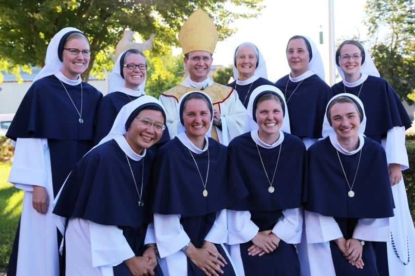 The group of Sisters professed in August, pictured with Bishop Andrew Cozzens and Mother Agnes.