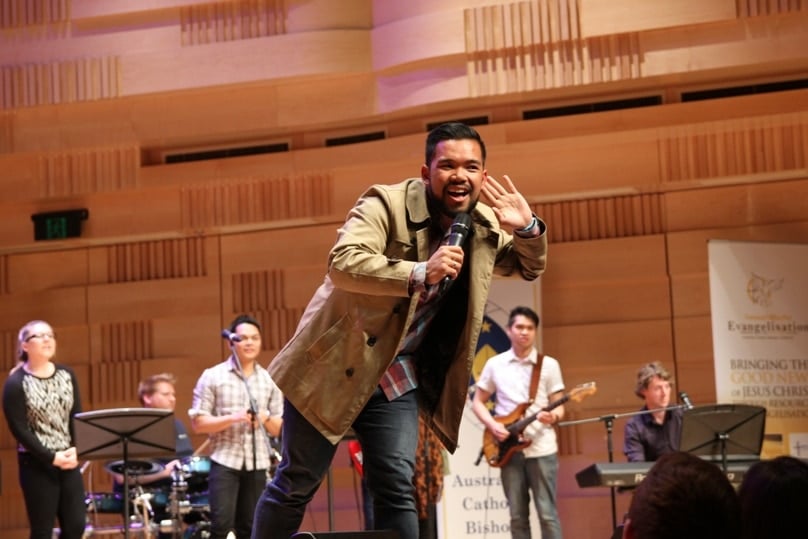 The worship band at Proclaim 2014 whips up the crowd. Photo: Robert Hiini