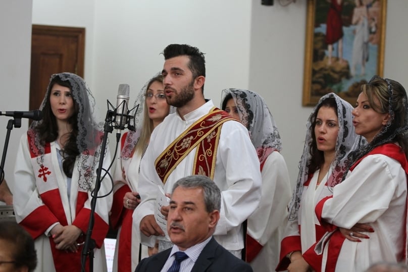 Members of Sydney’s Syrian Catholic community sing during the Divine Liturgy last weekend. Photo: Robert Hiini