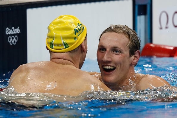 Australian swimmer Mack Horton is congratulated by David McKeon after winning gold in the men's 400m freestyle on the opening day of the Rio 2016 Olympic Games. Photo: Clive Rose/Getty Images