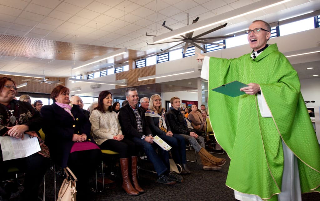 Fr David Catterall at the inaugural Mass for St Mary MacKillop parish, Oran Park. Photo: Jenny Yuen