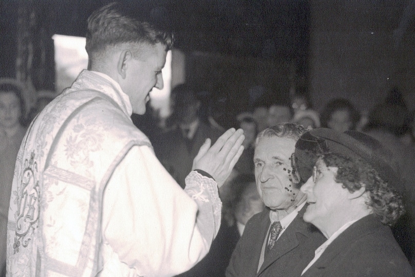 Mons John Walsh blesses his parents at his ordination in 1950.