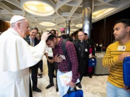 Pope Francis blesses young man at Youth Synod