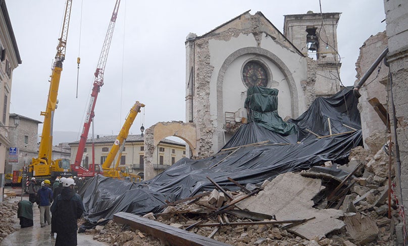 Monks from the Monastery of St. Benedict in Norcia, Italy, visit the site of their collapsed basilica, which was destroyed during the magnitude 6.5 earthquake that struck the town Oct. 30. PHOTO: CNS Photo/Courtesy the Monks of Norcia