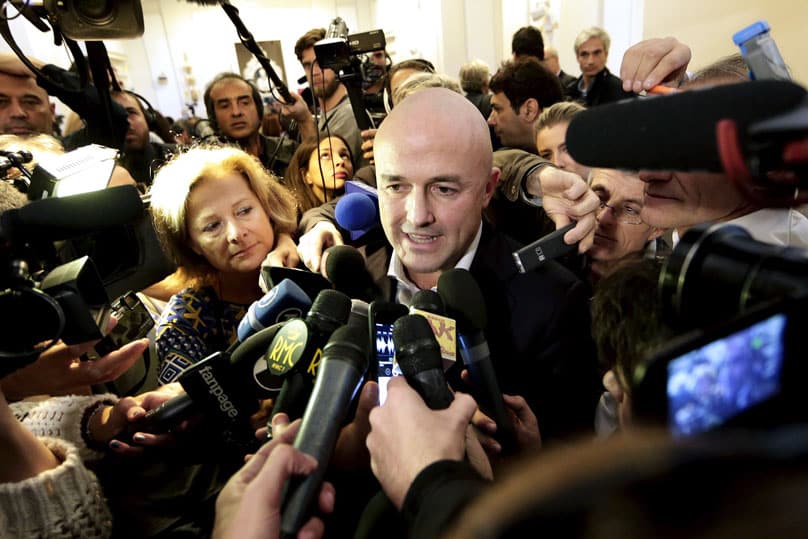 Italian journalist Gianluigi Nuzzi is surrounded by the media after a 4 November news conference for his new book "Merchants in the Temple: Inside Pope Francis' Secret Battle Against Corruption in the Vatican."