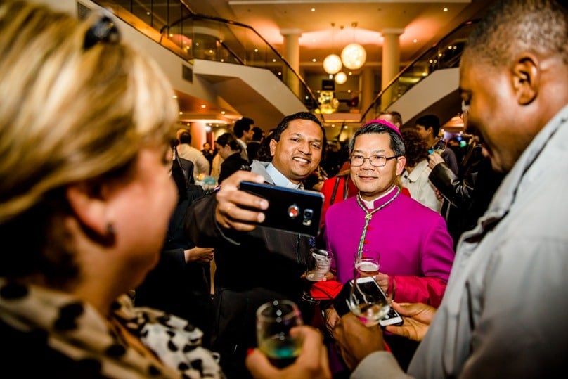 Bishop Vincent Long celebrates following his installation as Bishop of Parramatta. Photo: Alphonsus Fok