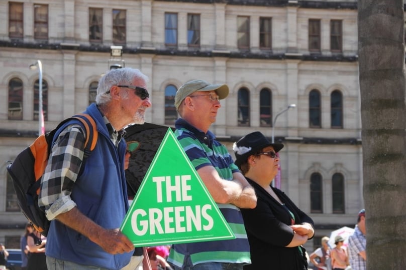 Unidentified protesters with Green party sign at in Brisbane in August 2014. Photo: paintings / Shutterstock.com
