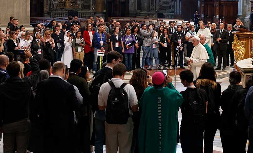 Pope Francis prepares to address young people who participated in a pilgrimage hike from the Monte Mario nature reserve in Rome to St. Peter's Basilica at the Vatican. Photo: CNS photo/Paul Haring