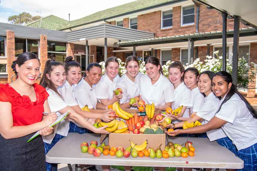 Students give fresh food hampers this Christmas