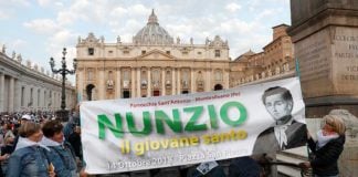 Women hold a banner with an image of new St. Nunzio Sulprizio during the canonization Mass for seven new saints celebrated by Pope Francis on 14 October in St. Peter's Square at the Vatican. Photo: CNS photo/Paul Haring