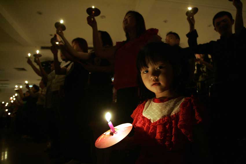 Girl holding candle