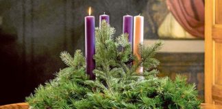 A lit candle is seen on an Advent wreath. Photo: CNS/Lisa Johnston, St Louis Review