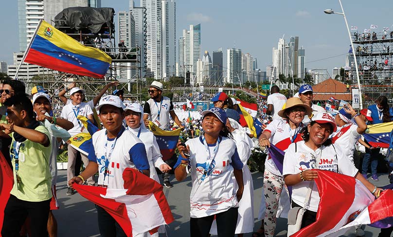 People cheer before Pope Francis' arrival at the welcoming ceremony in Panama City Photo: CNS Paul Haring.