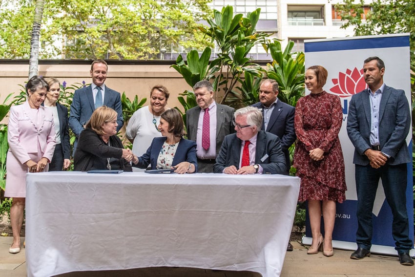 NSW Premier Gladys Berejiklian and Chair of the Institute of Global Homelessness, Dame Louise Casey shake hands after signing the agreement to halve rough sleeping in NSW by 2025. PHOTO: Giovanni Portelli