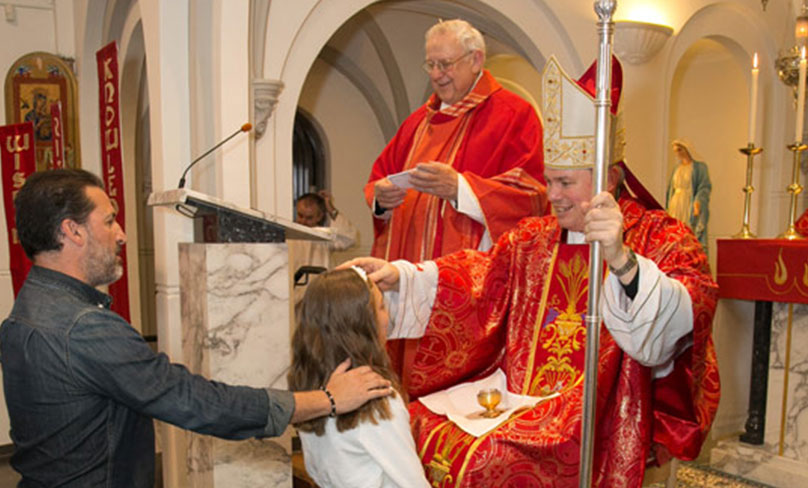 Sydney auxiliary bishop Richard Umbers confirms a student. Photo: supplied