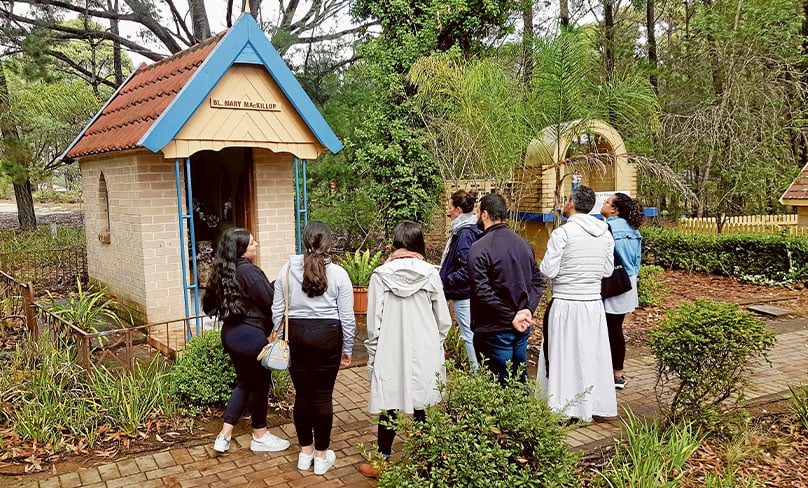 Youth reflect upon the saints in Penrose Park on 17 May. Photo: Mathew De Sousa