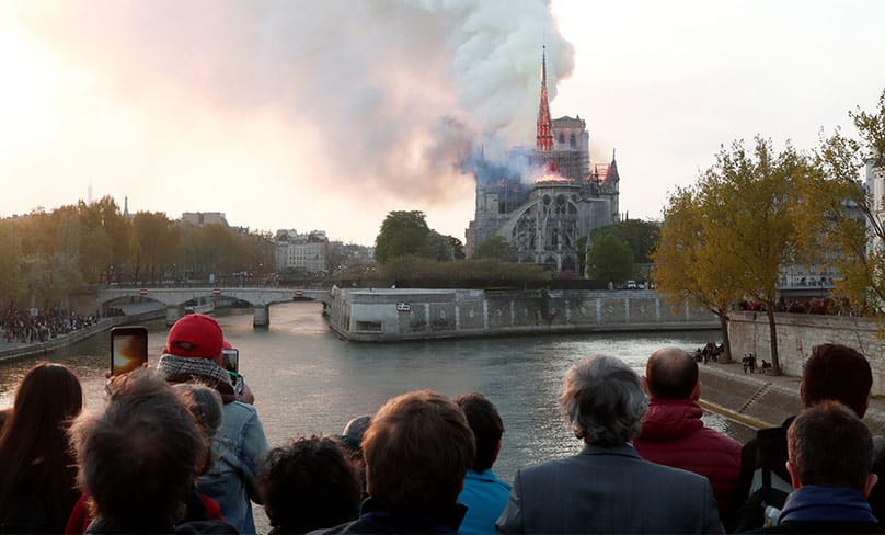 Flames and smoke billow from the Notre Dame Cathedral after a fire broke out in Paris April 15, 2019. Photo: CNS photo/Benoit Tessier, Reuters 