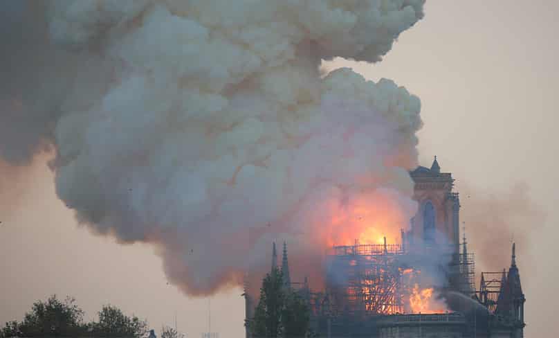 Flames and smoke billow from the Notre Dame Cathedral after a fire broke out in Paris April 15, 2019. Photo: CNS photo/Charles Platiau, Reuters