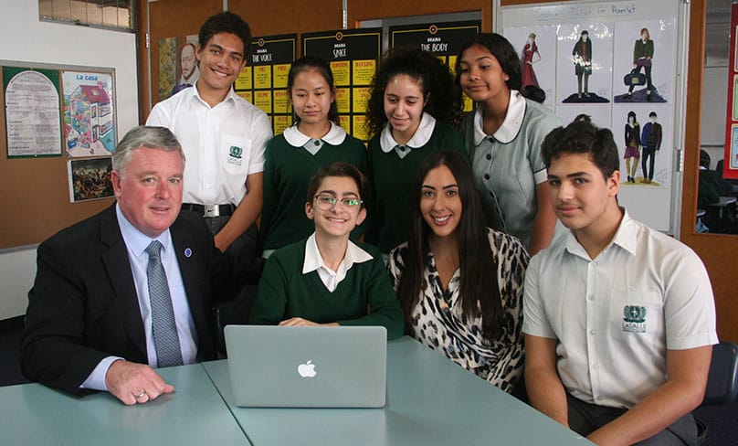 Michael Egan, principal of La Salle Catholic College, Bankstown, with some of his students.