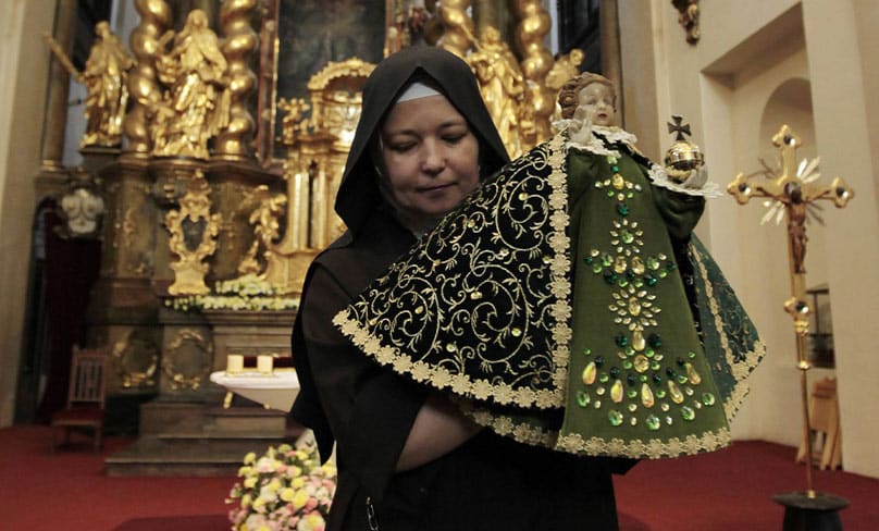 A nun carries a statue of the Infant Jesus of Prague in the Church of Our Lady Victorious in Prague, Czech Republic, in preparation for Pope Benedict XVI's visit in the beginning of September, 2009. Photo: CNS photo/Petr Josek, Reuters