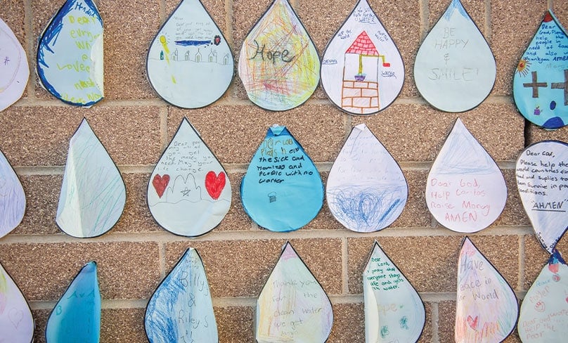 Students at St John Bosco in Engadine wrote special prayers on cardboard droplets of rain asking for those in need to receive it. Photo: Giovanni Portelli