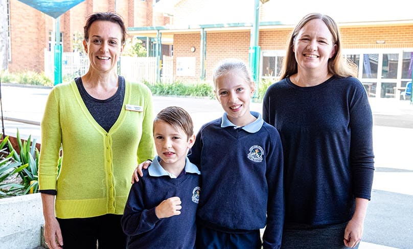 Support teacher Catherine Davies with Jacob, Lizzy and mum Lesleigh. Photo: Alphonsus Fok