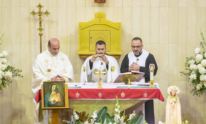 Almost 1000 Catholics from three rites – Maronite, Melkite and Roman—took their faith to the streets of western Sydney for the feast of Corpus Christi. Photo: Giovanni Portelli