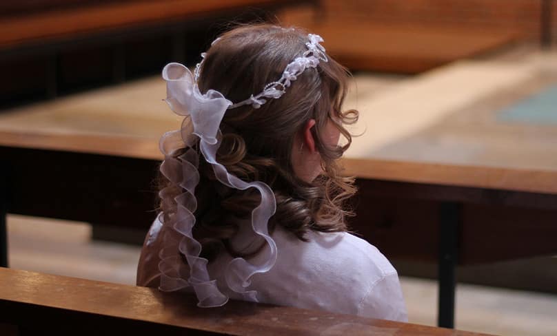 Girl at her first communion.