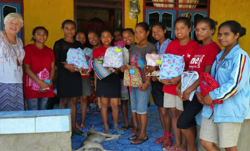 Women and girls in need in Timor Leste with their washable kits that will last for about two years. Photo: Supplied
