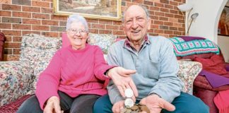 Terry and Beverley Fitzpatrick display some of the coins they’ve collected and which are headed for – in this case – Jesuit Mission. Photo: Giovanni Portelli