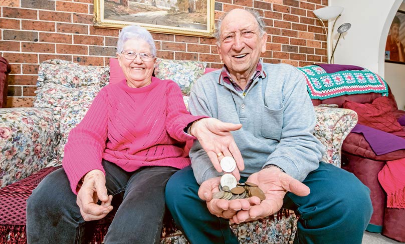 Terry and Beverley Fitzpatrick display some of the coins they’ve collected and which are headed for – in this case – Jesuit Mission. Photo: Giovanni Portelli