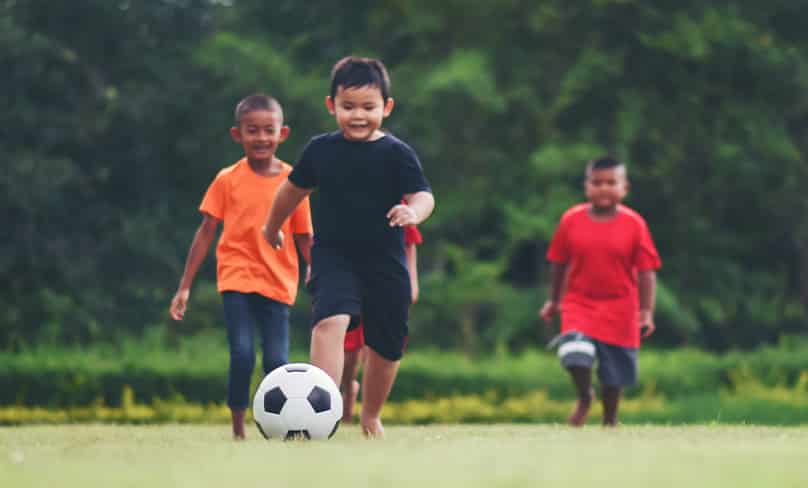 Children having fun playing soccer.