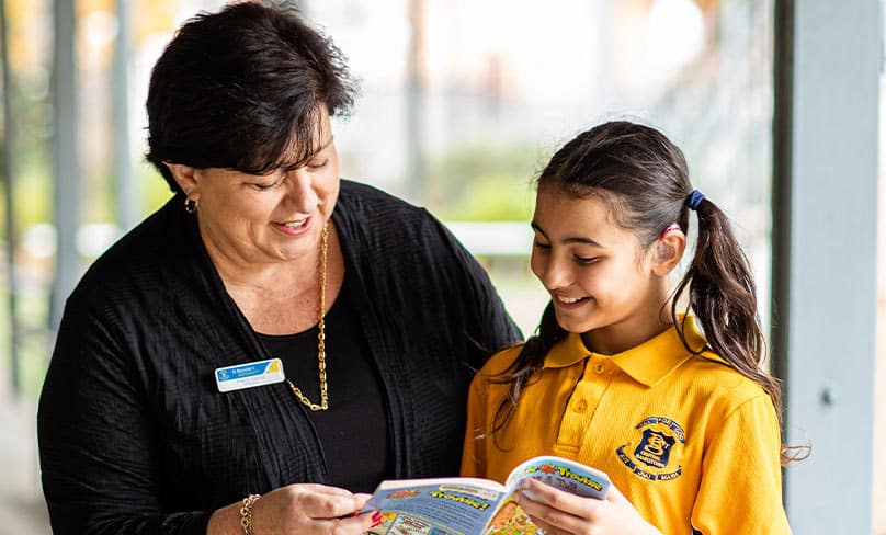 Principal Maria Femia with hearing impaired student Grace Kambour. Photo: Alphonsus Fok