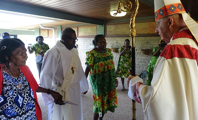 Bishop Geoffrey Jarrett greets Deacon Kopel Gibuma at his Ordination Mass. Photo: ACBC