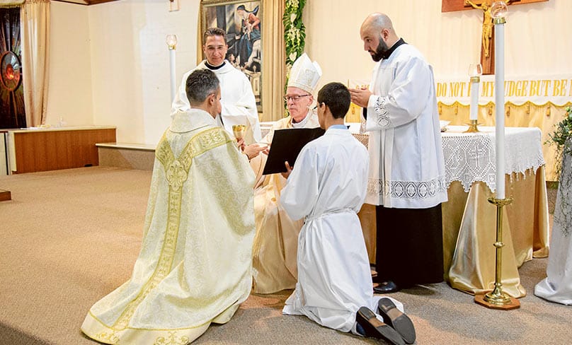 Fr Chris is ordained by Perth Bishop Donald Sproxton on 11 May. Photo: Jamie O’Brien / courtesy De Sousa family