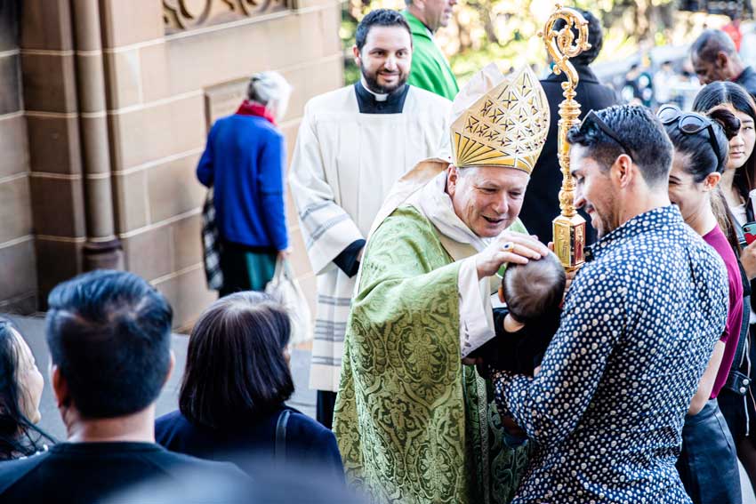 Archbishop Anthomy Fisher OP blesses a child outside St Mary’s Cathedral in 2019. The Instrumentum Laboris – the main working document for Plenary 2021’s discussions – has identified the Church’s teaching on sexual morality as a significant issue affecting how Australians view the Catholic Church Photo: Alphonsus Fok
