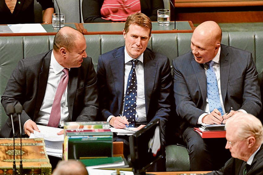 Attorney General Christian Porter, centre, unveils the government’s religious freedom legislation. Photo: AAP, Sam Mooy