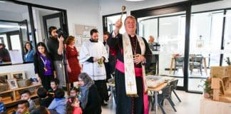 Archbishop Anthony Fisher OP blesses the new childcare centre in Sadleir. Photo: Kitty Beale