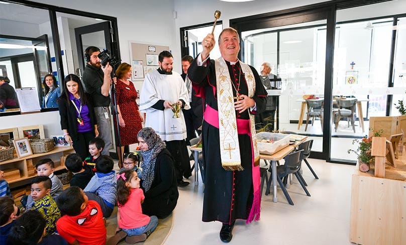 Archbishop Anthony Fisher OP blesses the new childcare centre in Sadleir. Photo: Kitty Beale