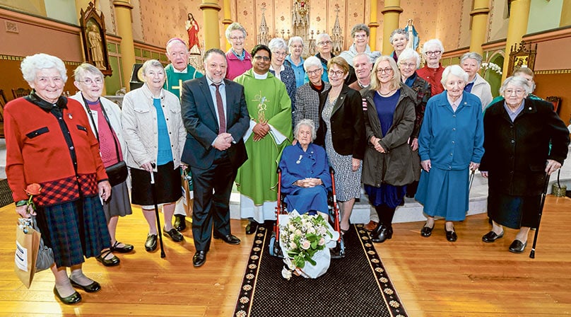 Bishop Terry Brady, Parish Priest Fr Salas Muttathukattil MSFS, parishioners and sisters including Sr Mary Constable, centre, gather for the farewell. Photo: Patrick Lee