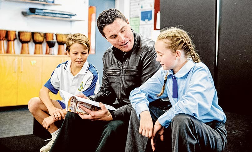 Fr Dan McCaughan with actors, Lachie Edgell ‘adult Simba’ and Chloe Lewis ‘young Simba’. Photo: Alphonsus Fok