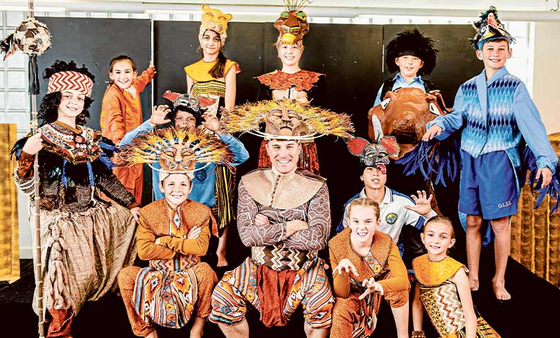 Fr Dan McCaughan with the cast of Our Lady Star of the Sea’s production of The Lion King. Photo: Alphonsus Fok
