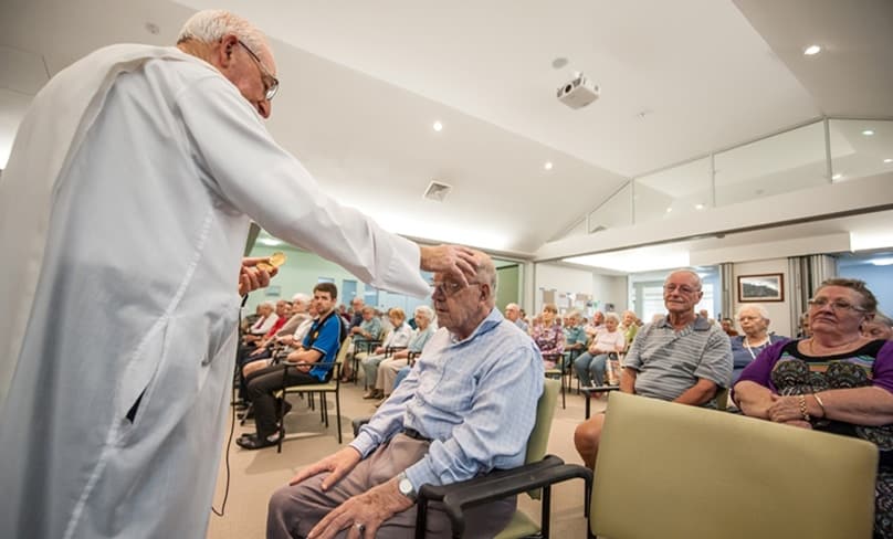 Residents at John Paul Village receive the Anointing of Sick on Holy Thursday. Photo: Giovanni Portelli