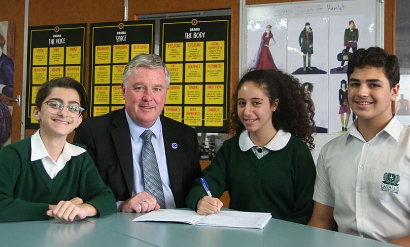 Michael Egan, principal at LaSalle Catholic College , with students from the school.