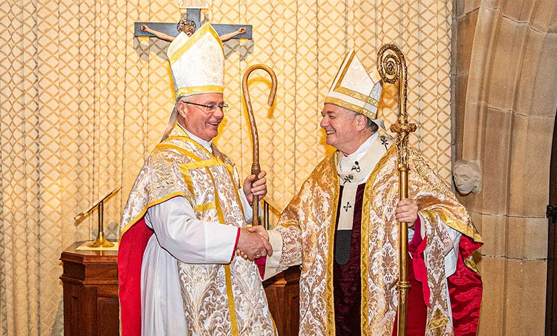 Monsignor Carl Reid greets Archbishop Anthony Fisher OP at his installation in St Mary’s Cathedral on 27 August. Photo: Alphonsus Fok