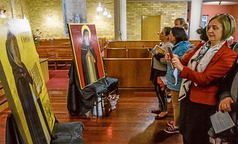 Staff and students view the new icons for Santa Sabina College in Strathfield. Photo: Brian Walker