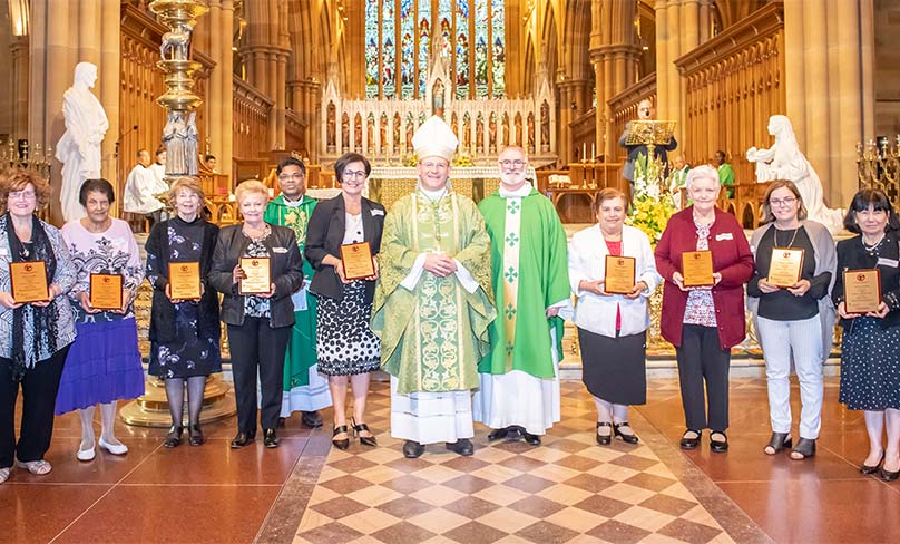 Bishop Randazzo with some of the 100 catechists who were presented with awards for their many years of service. Photo: Giovanni Portelli