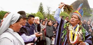 Isidoro Jajoy, a shaman from Colombia’s Inga tribe, blesses people in Bogota during a preparatory meeting for the October Synod of Bishops for the Amazon. Photo: CNS photo/Manuel Rueda